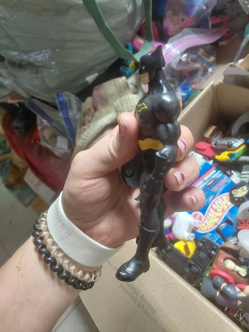 6-inch Mattel Justice League Batman action figure, recognized by its bright yell